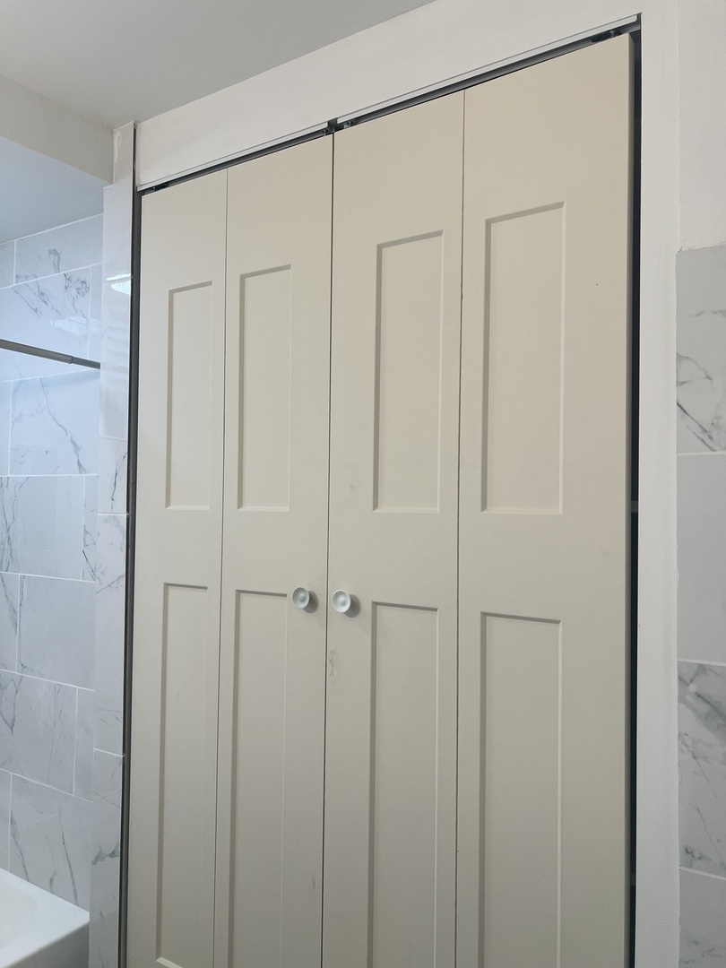 1921 North Pulaski Road, Unit 1 Chicago, IL 60639 - Photo 16 of 16 a bathroom with a shower and a glass door