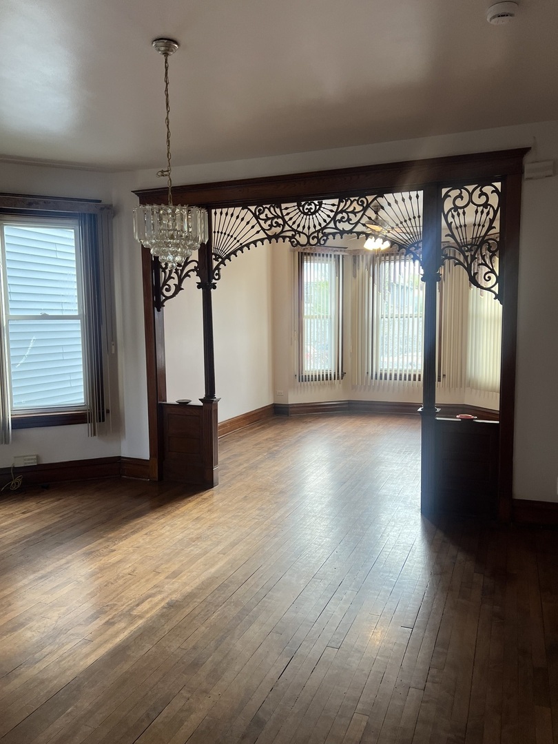 1921 North Pulaski Road, Unit 1 Chicago, IL 60639 - Photo 4 of 16 a view of a room with wooden floor and windows