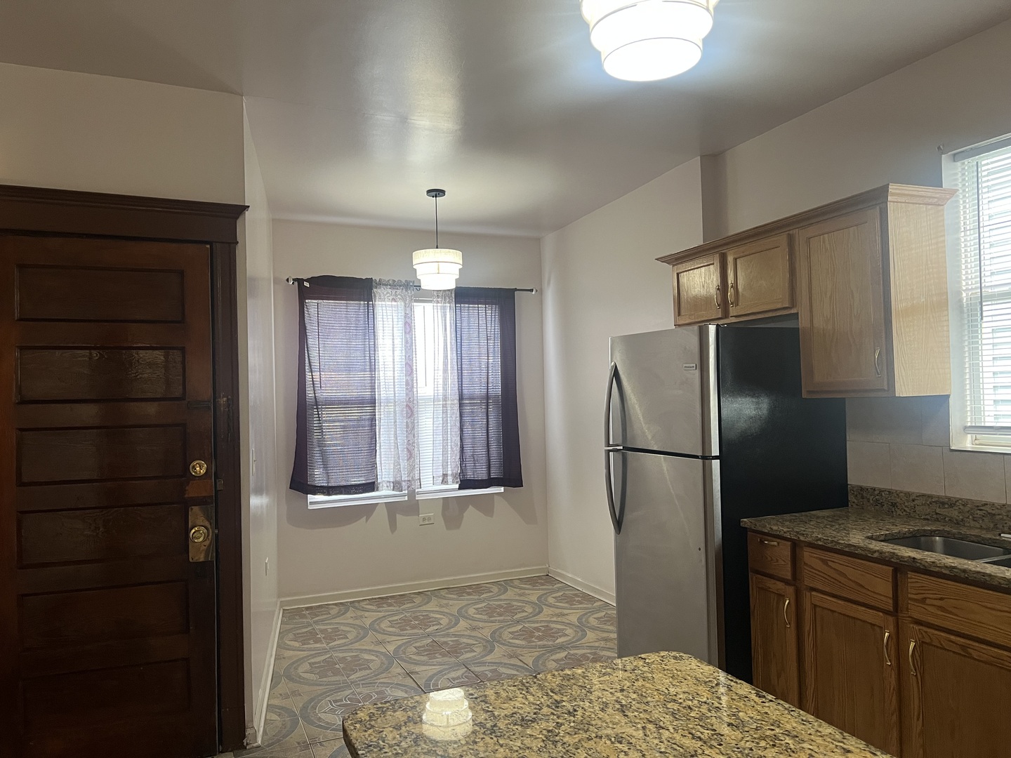 1921 North Pulaski Road, Unit 1 Chicago, IL 60639 - Photo 9 of 16 a kitchen with a refrigerator and a sink