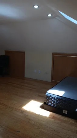 a view of room with hardwood floor