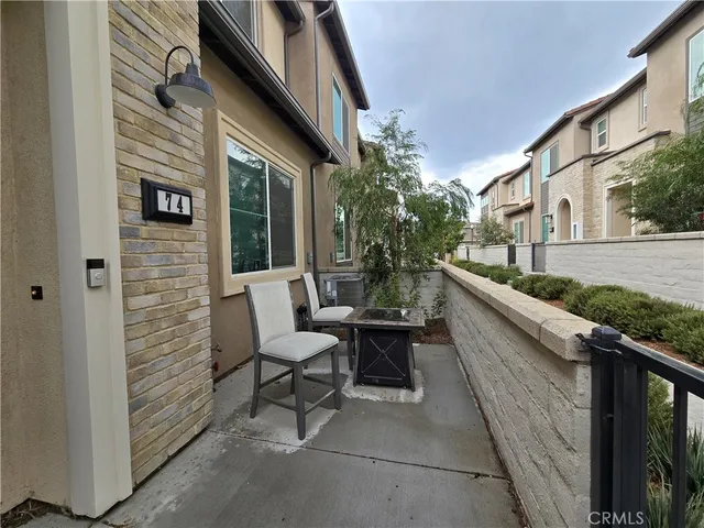 a view of two chairs in the balcony