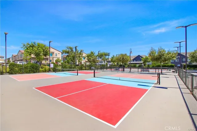 a view of an outdoor space and tennis court