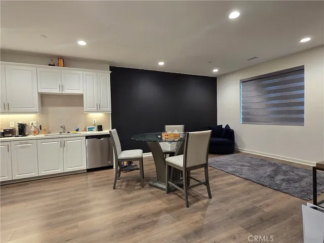 a kitchen with a table and chairs