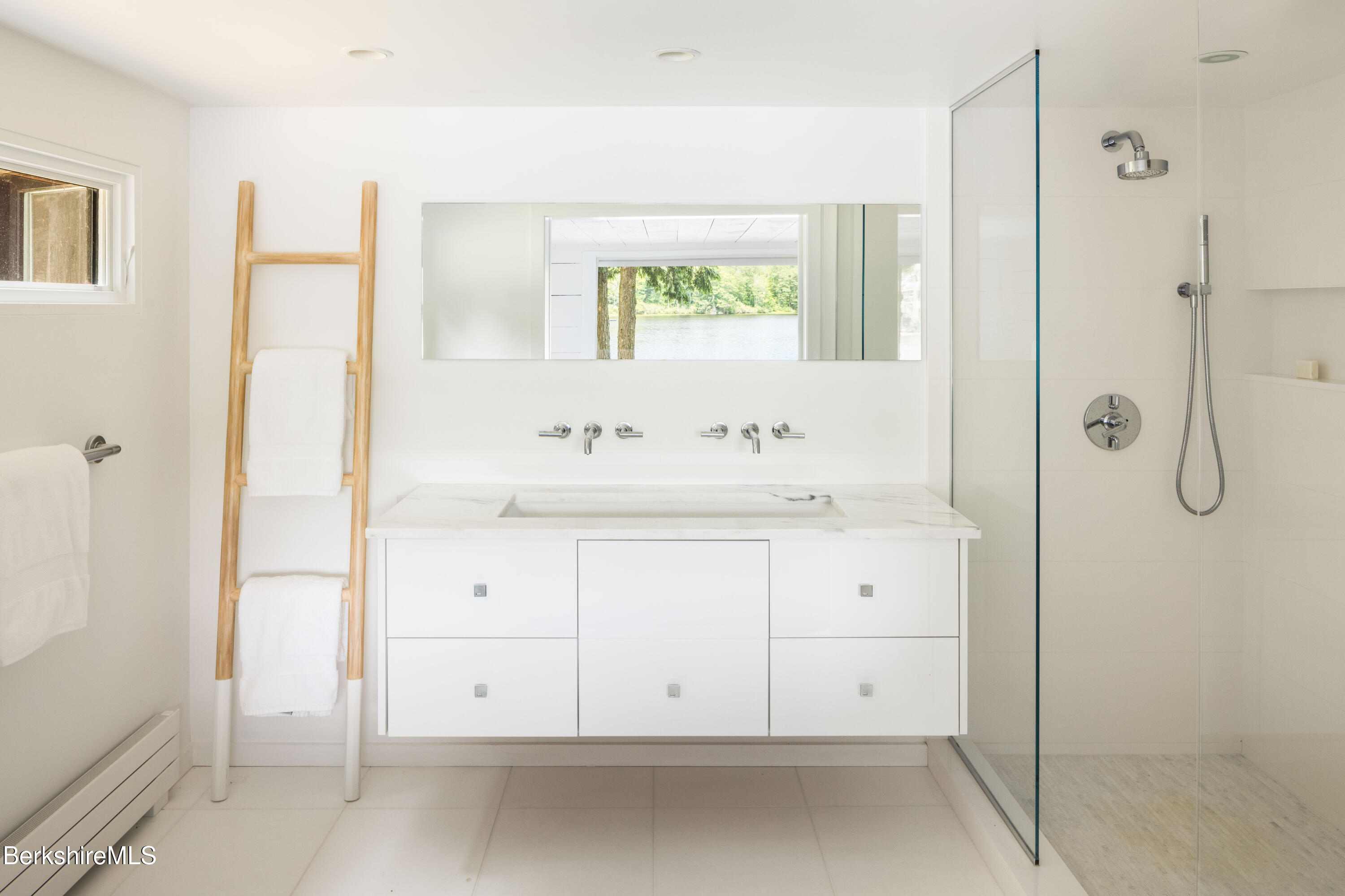 14 Sullivan Road Sandisfield, MA 01255 - Photo 12 of 54 a bathroom with a sink vanity and a mirror