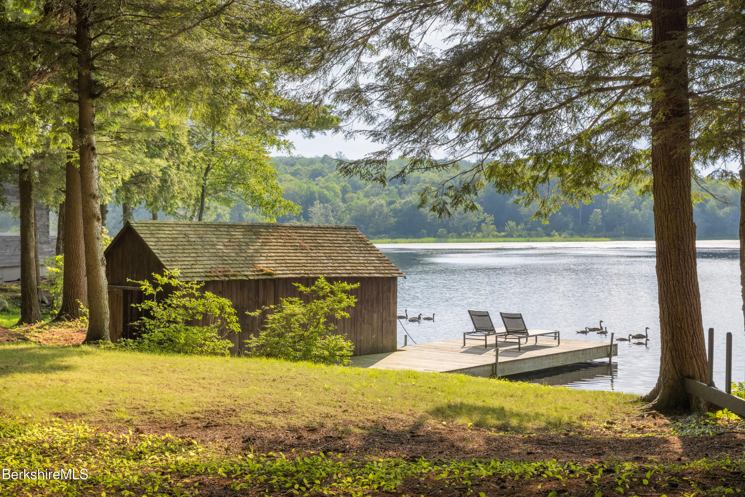 14 Sullivan Road Sandisfield, MA 01255 - Photo 25 of 54 a view of a house with backyard swimming pool and sitting area