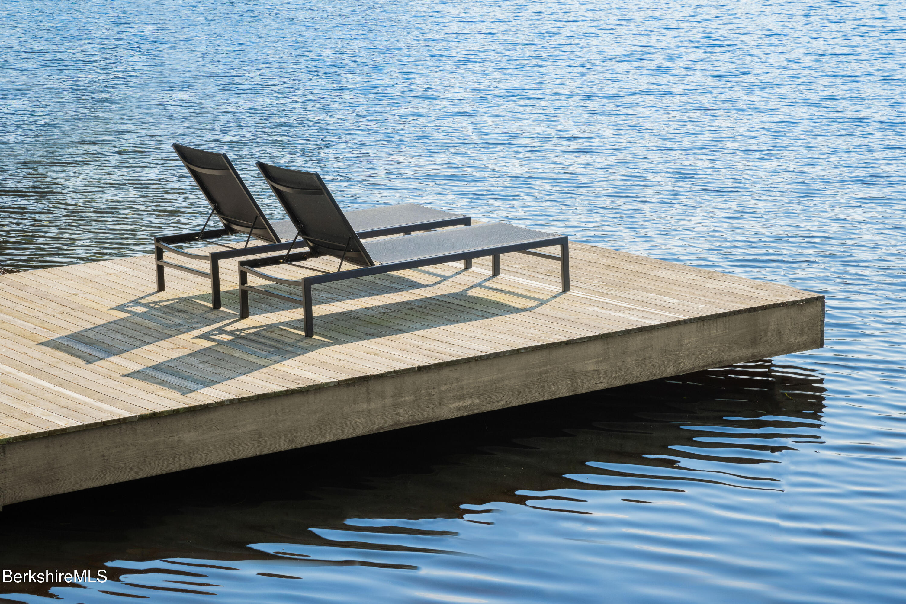 14 Sullivan Road Sandisfield, MA 01255 - Photo 26 of 54 a wooden bench sitting on top of a wooden floor