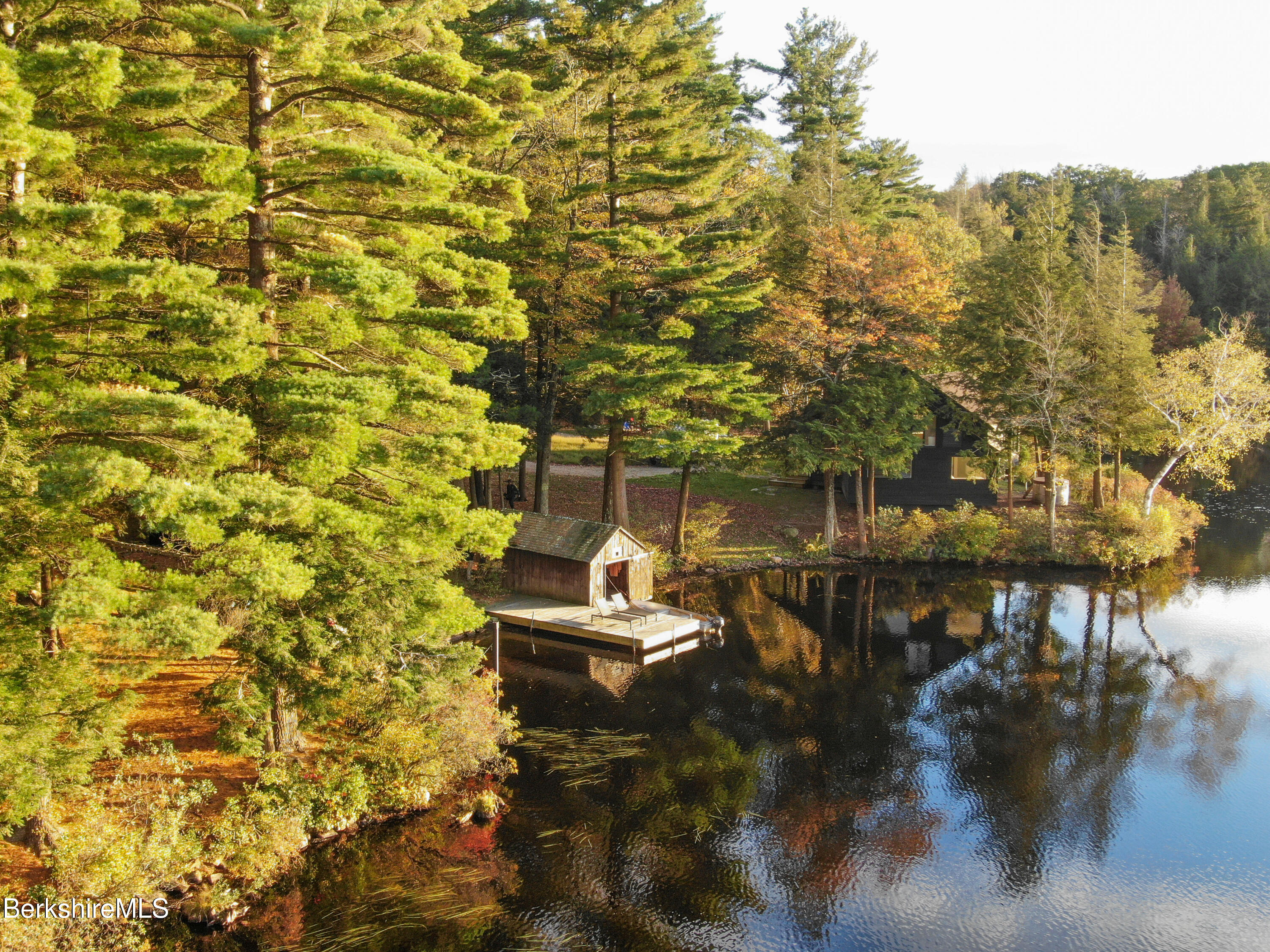14 Sullivan Road Sandisfield, MA 01255 - Photo 27 of 54 a backyard of a house with table and chairs