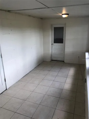 a view of a utility room and empty room