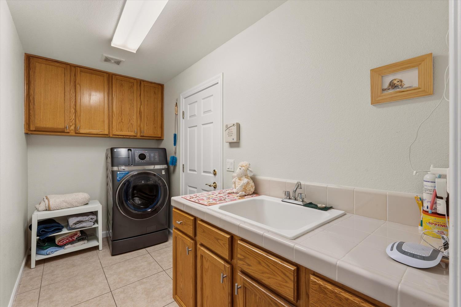 6503 Turnstone Way Rocklin, CA 95765 - Photo 21 of 42 a utility room with sink dryer and washer