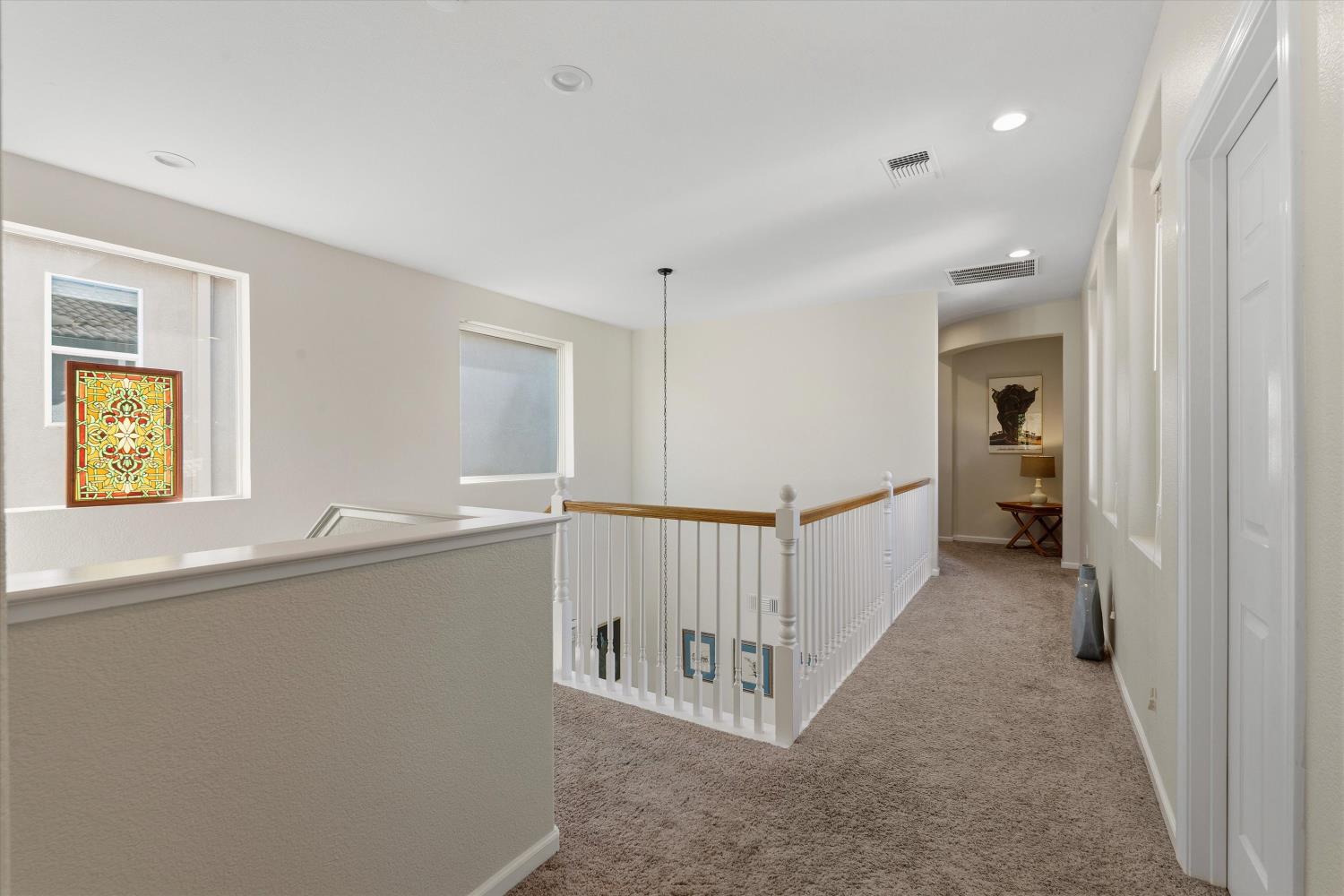 6503 Turnstone Way Rocklin, CA 95765 - Photo 22 of 42 a view of hallway with stairs and a window