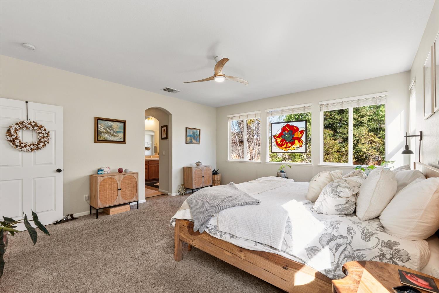 6503 Turnstone Way Rocklin, CA 95765 - Photo 25 of 42 a bedroom with a bed and a chandelier