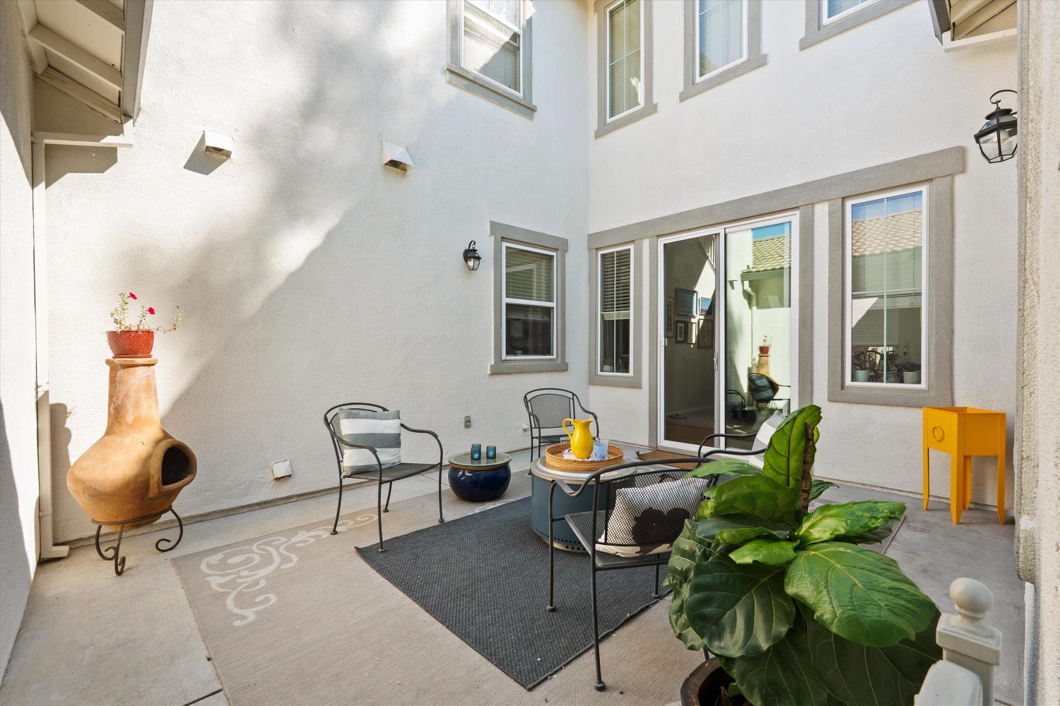 6503 Turnstone Way Rocklin, CA 95765 - Photo 5 of 42 a living room with patio furniture and potted plants