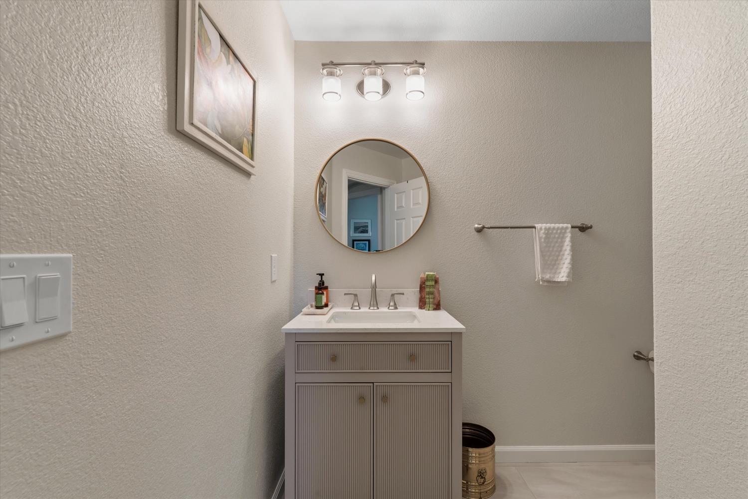6503 Turnstone Way Rocklin, CA 95765 - Photo 8 of 42 a bathroom with a sink and a mirror