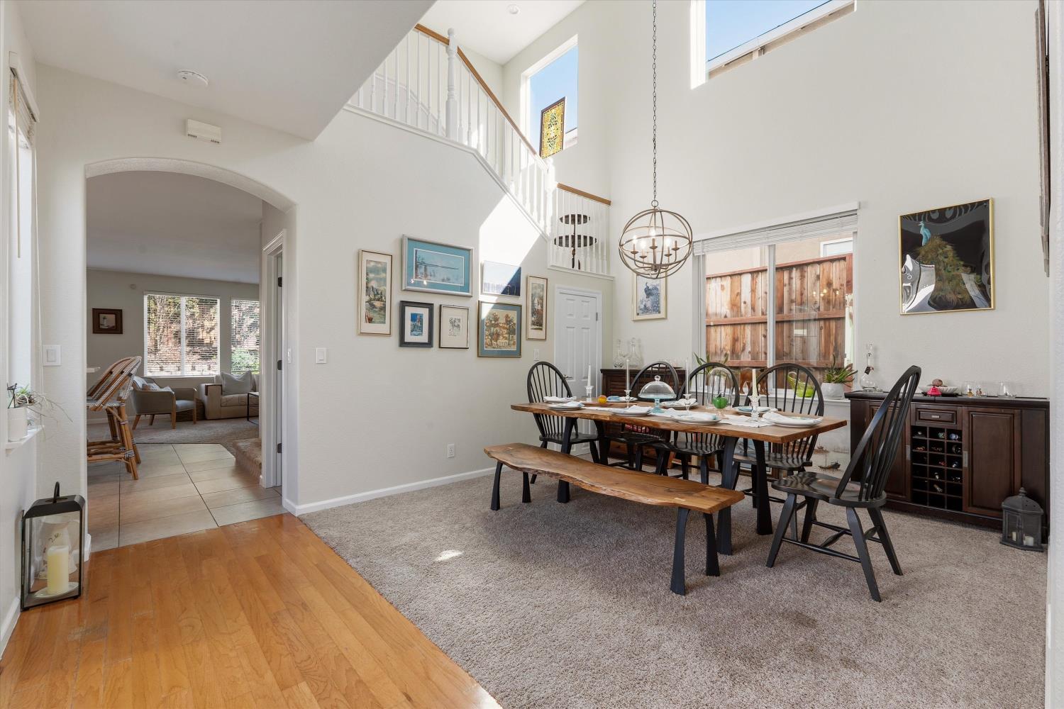 6503 Turnstone Way Rocklin, CA 95765 - Photo 10 of 42 a living room with furniture a rug and a chandelier