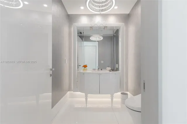 a bathroom with a granite countertop shower a toilet and a sink