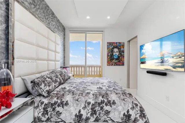 a bedroom with a bed and a view of en suite bathroom