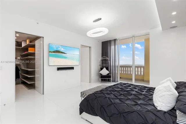 a lobby with furniture and floor to ceiling window