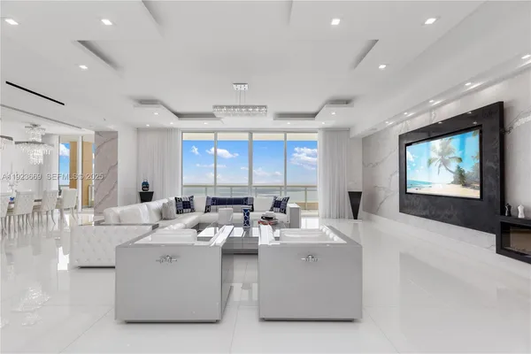 a living room with furniture and a flat screen tv
