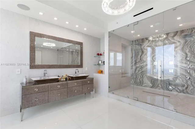 a bathroom with a sink mirror and vanity