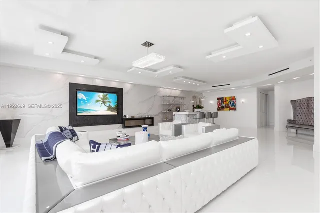 a view of a dining room with furniture and a chandelier