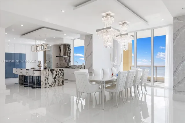 a kitchen with stainless steel appliances kitchen island granite countertop a sink and cabinets