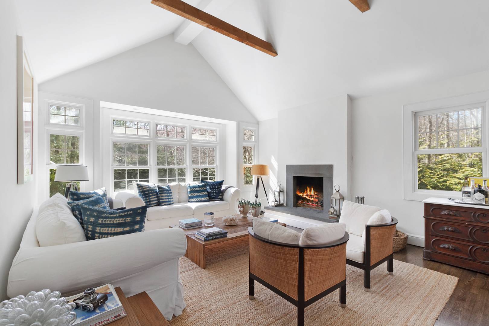 334 Brick Kiln Road Sag Harbor, NY 11963 - Photo 2 of 18 a living room with furniture large window and a fireplace