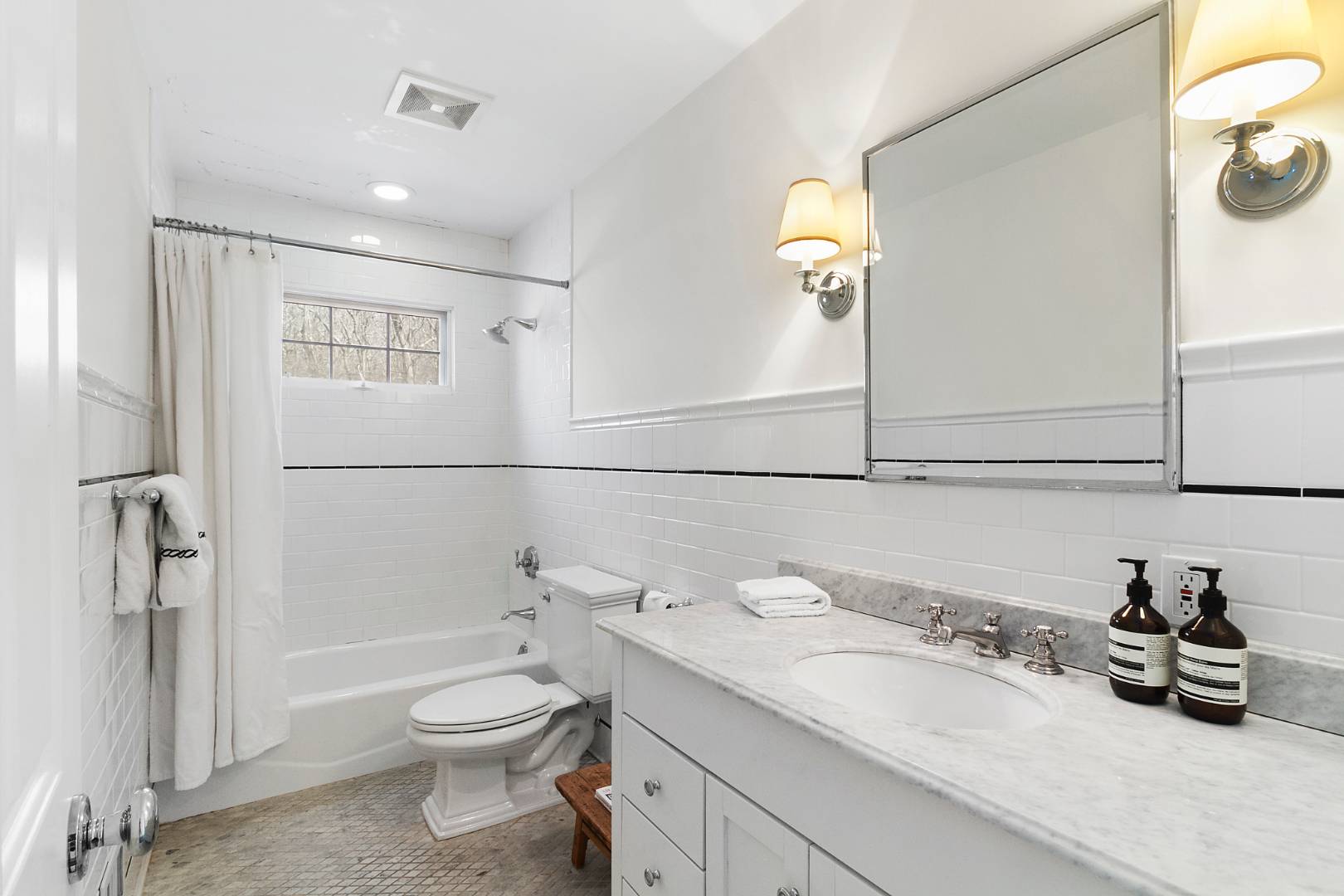 334 Brick Kiln Road Sag Harbor, NY 11963 - Photo 13 of 18 a bathroom with a granite countertop sink a toilet and shower