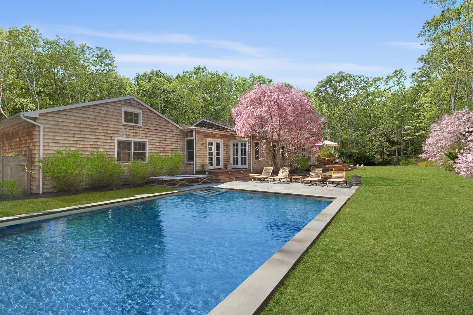 334 Brick Kiln Road Sag Harbor, NY 11963 - Photo 6 of 18 a view of a house with swimming pool and a yard