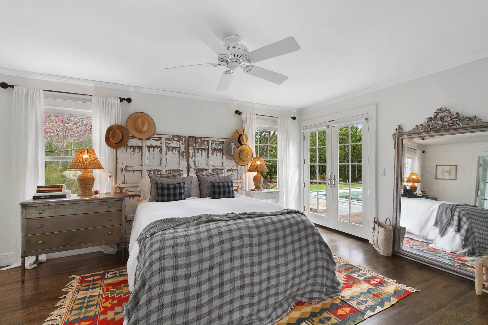 334 Brick Kiln Road Sag Harbor, NY 11963 - Photo 7 of 18 a bedroom with a bed mirror and a window