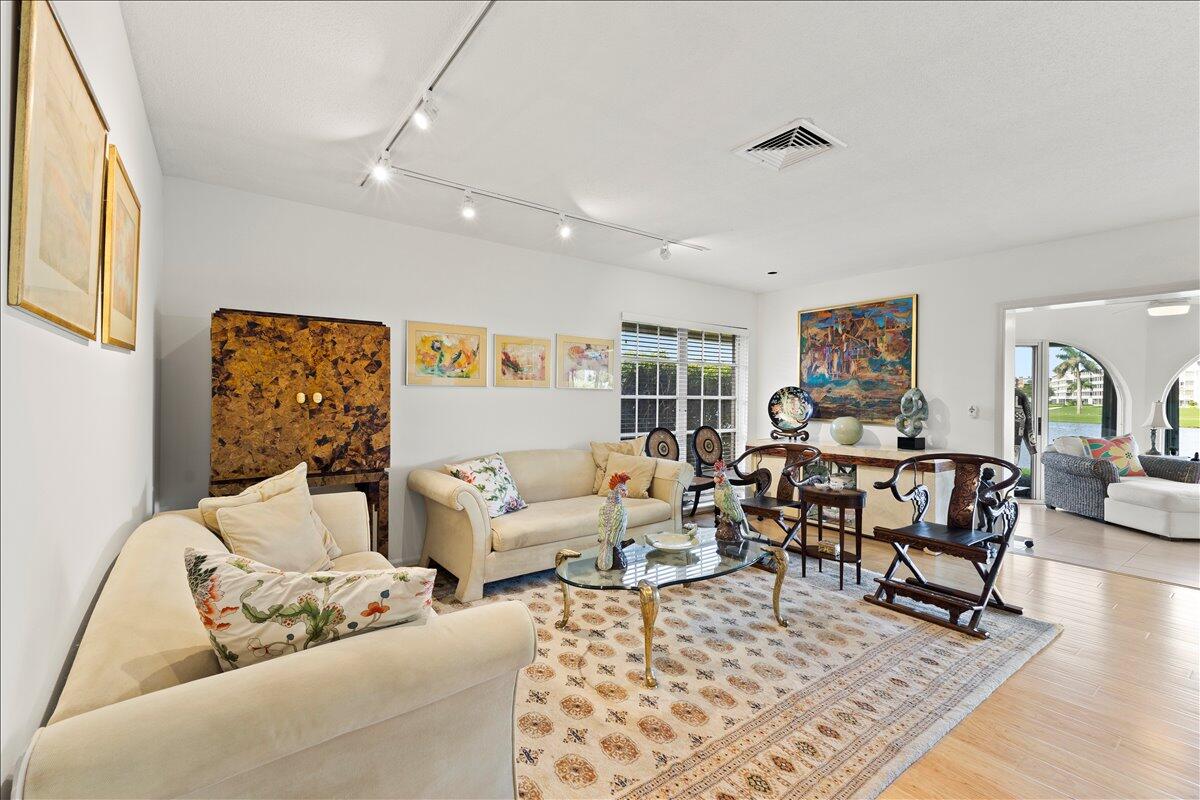 233 Rio Vista Circle Atlantis, FL 33462 - Photo 11 of 38 a living room with furniture and a rug