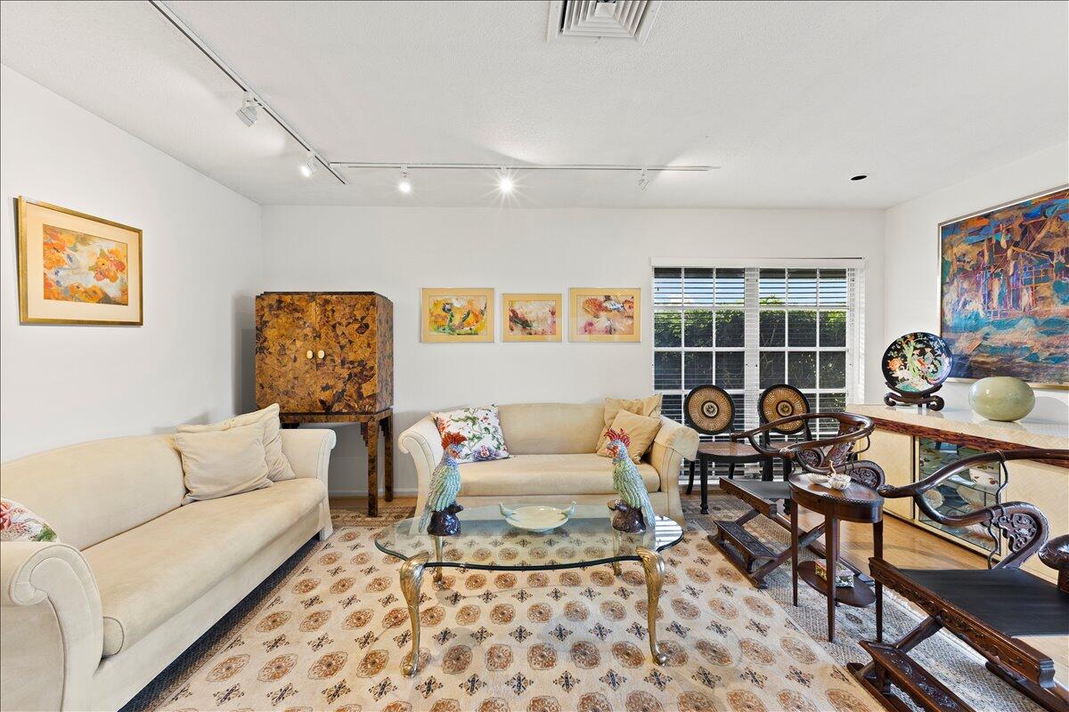 233 Rio Vista Circle Atlantis, FL 33462 - Photo 13 of 38 a living room with furniture and a rug
