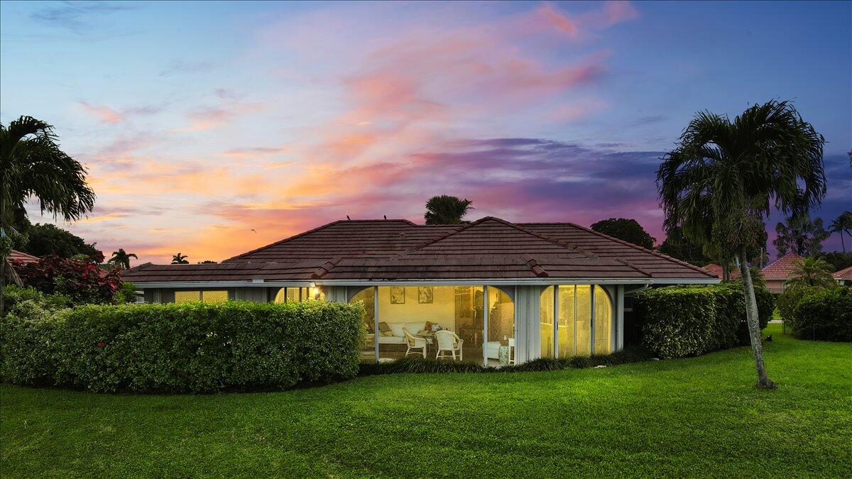 233 Rio Vista Circle Atlantis, FL 33462 - Photo 31 of 38 a view of a house with a garden