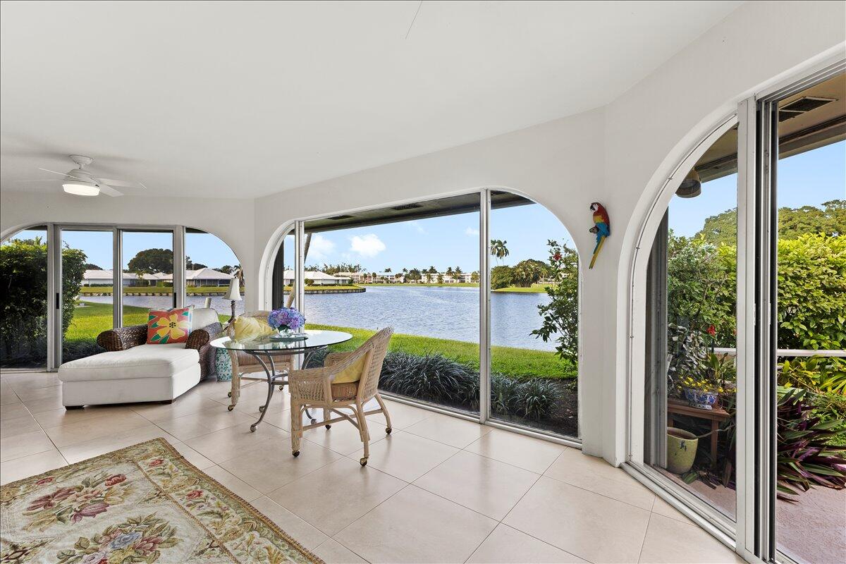 233 Rio Vista Circle Atlantis, FL 33462 - Photo 7 of 38 a living room with furniture and a large window