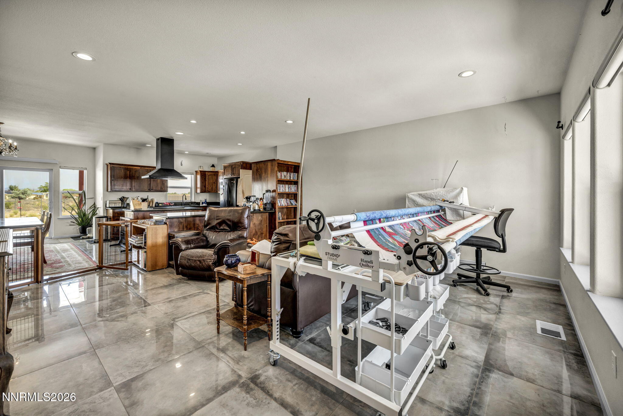 1286 Sky Ridge Drive Fallon, NV 89406 - Photo 14 of 49 a living room with lots of furniture and a view of kitchen