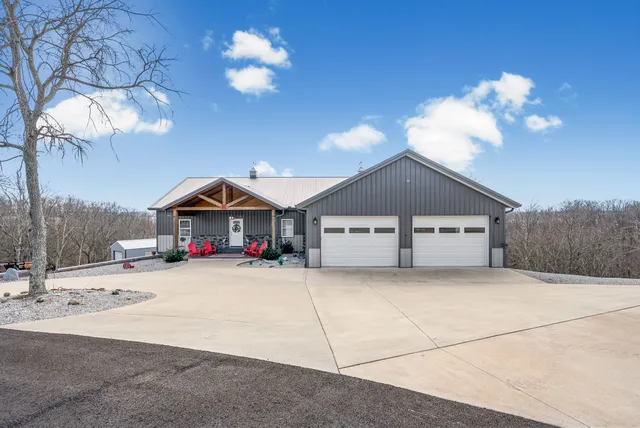a view of a house with a snow in the yard