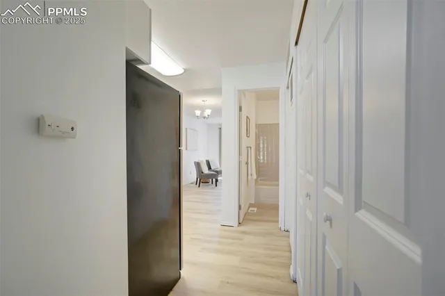 a view of a bathroom from a hallway