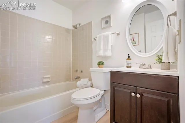 a bathroom with a sink mirror toilet and bathtub