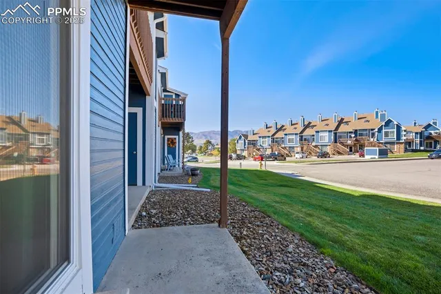a view of a street with cars on the road