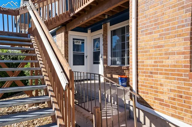 a view of balcony with wooden floor and stairs