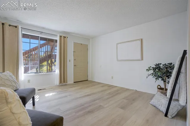 a view of livingroom with furniture and window