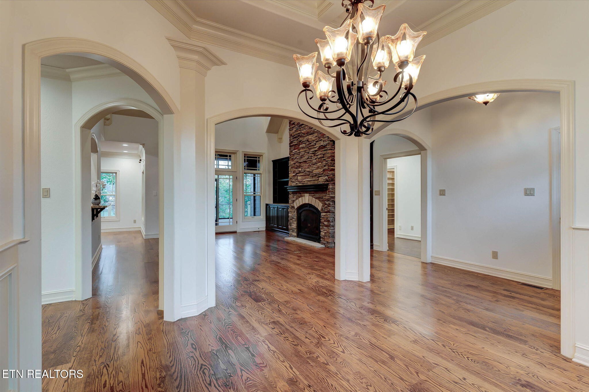 494 Chestnut Lane Loudon, TN 37774 - Photo 13 of 58 a view of a livingroom with wooden floor a chandelier and entryway