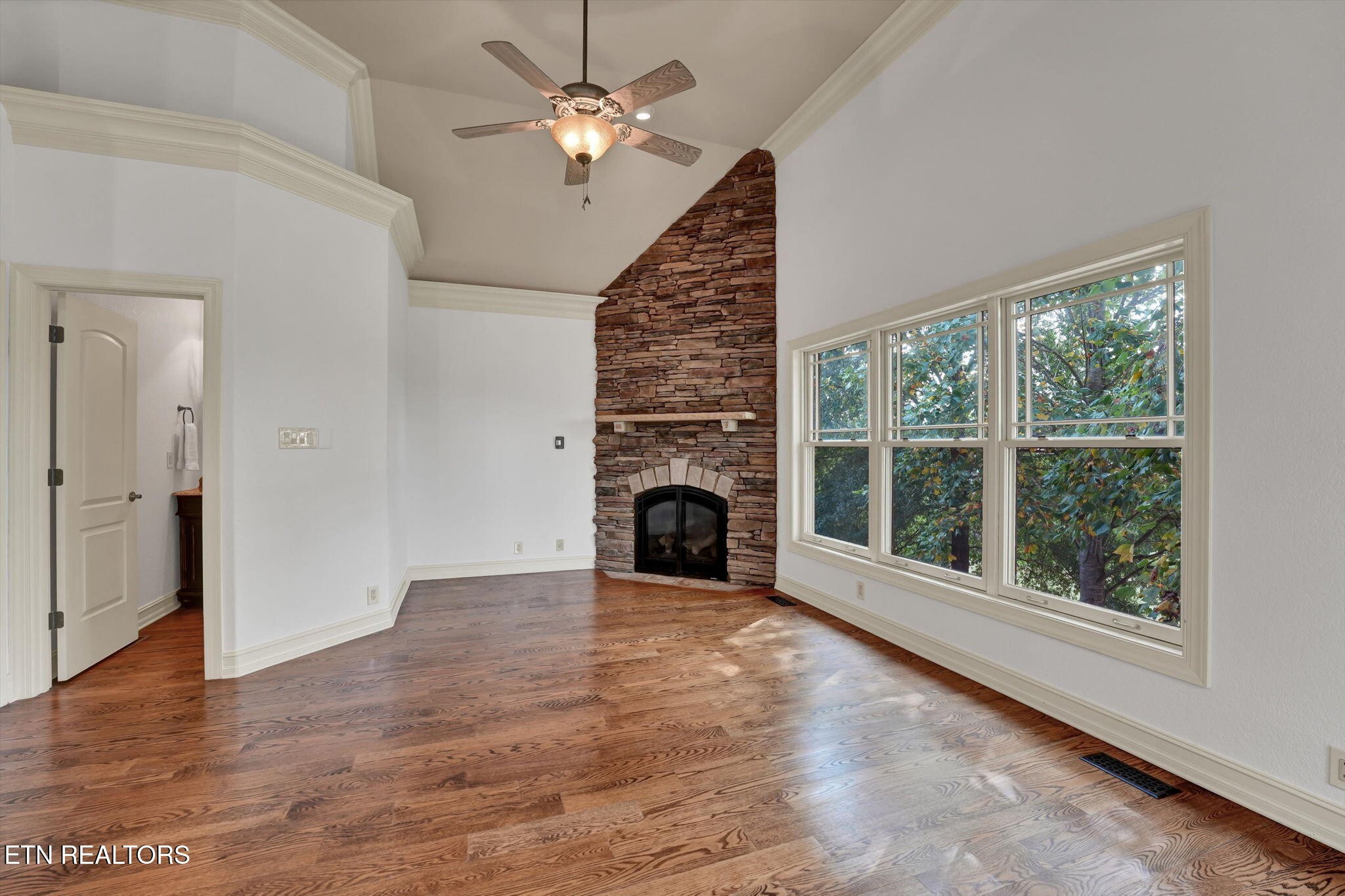 494 Chestnut Lane Loudon, TN 37774 - Photo 23 of 58 a view of empty room with fireplace fan and windows