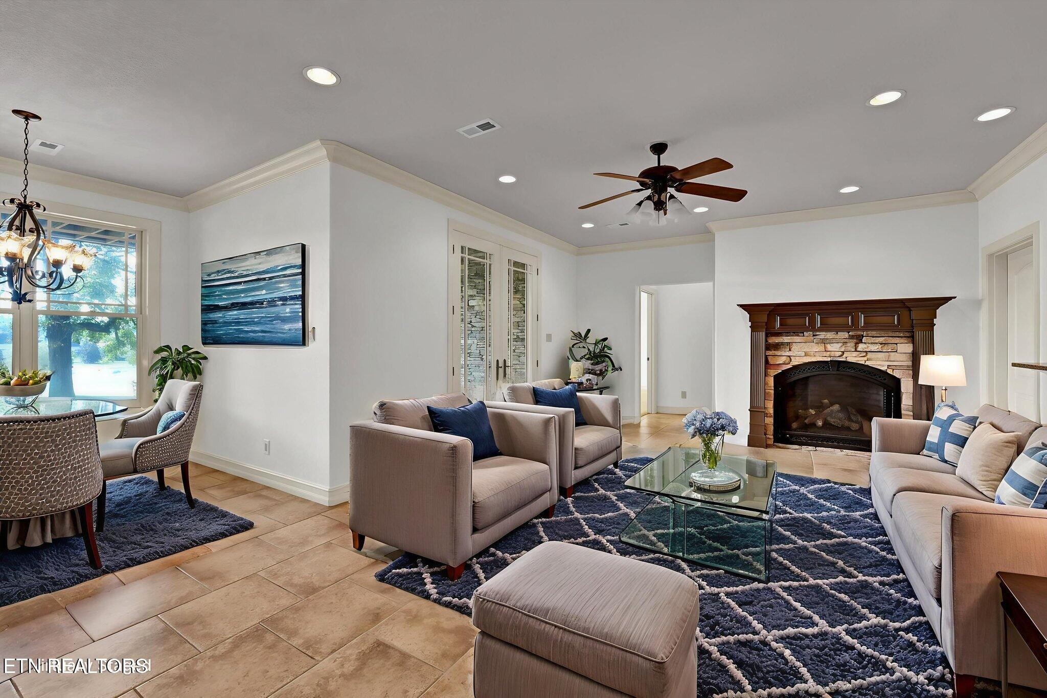 494 Chestnut Lane Loudon, TN 37774 - Photo 37 of 58 a living room with furniture a fireplace and a table
