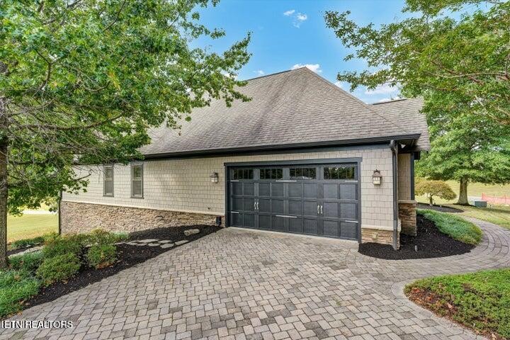 494 Chestnut Lane Loudon, TN 37774 - Photo 50 of 58 a front view of a house with a yard and garage