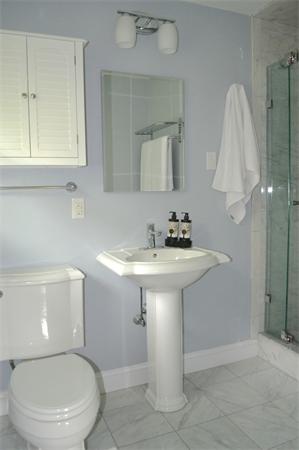 6 Barrett Road Lexington, MA 02421 - Photo 12 of 20 a bathroom with a sink a toilet and mirror