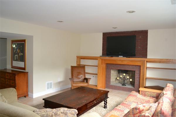 6 Barrett Road Lexington, MA 02421 - Photo 14 of 20 a living room with furniture a flat screen tv and a fireplace