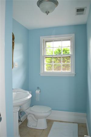 6 Barrett Road Lexington, MA 02421 - Photo 15 of 20 a white toilet sitting next to a bathroom sink and vanity
