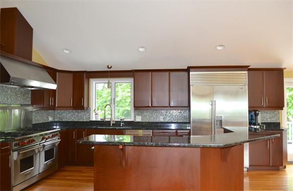 6 Barrett Road Lexington, MA 02421 - Photo 2 of 20 a kitchen with stainless steel appliances granite countertop a sink a stove and a refrigerator