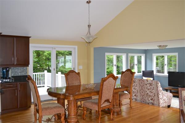 6 Barrett Road Lexington, MA 02421 - Photo 3 of 20 a view of a dining room with furniture large windows and wooden floor