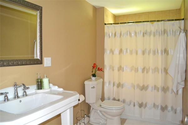 6 Barrett Road Lexington, MA 02421 - Photo 9 of 20 a bathroom with a sink and a mirror
